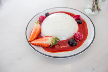 The food background is a dessert in a coffee shop, bakery shop, which consists of strawberries, milk bubbles, butter, as an alternative menu for health-loving customers and has a small amount of sugar