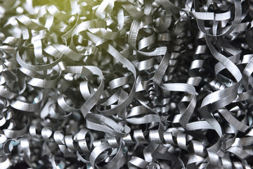 A lot of metal shavings after working on a milling machine or CNC machine. Metal shavings texture
