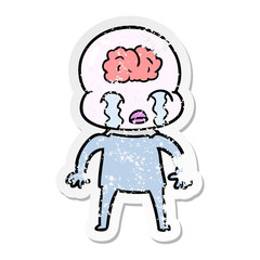 distressed sticker of a cartoon big brain alien crying