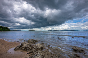 The background of a cloudy sky, colorful like a storm, and rain later, with blurring of wind and sea together, is a phenomenon that occurs naturally.