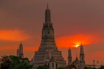 Deurstickers Twilight wallpaper in the evening,the sun going back to the horizon,Wat Arun Ratchawaramaram is a temple along the ChaoPhraya River is an important place and a beautiful tourist destination in Bangkok © bangprik