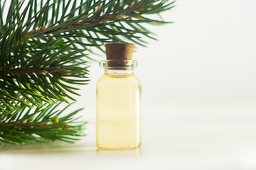 Essence of pine on table in beautiful glass jar