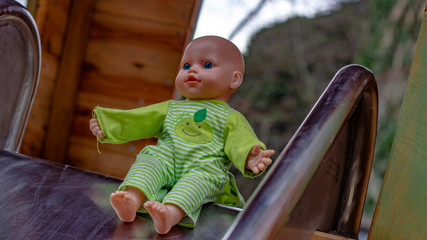 A Baby-doll playing in the playground