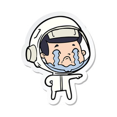 sticker of a cartoon crying astronaut