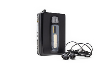 Vintage audio player. Old fashioned portable cassette player, cult object, icon and symbol of the 80s and 90s. Headphones isolated on white background.
