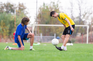 Young children player on the football match
