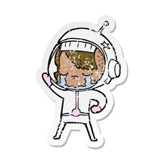 distressed sticker of a cartoon crying astronaut girl