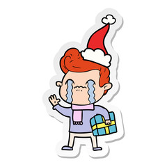 sticker cartoon of a man crying wearing santa hat