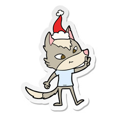 friendly sticker cartoon of a wolf giving peace sign wearing santa hat