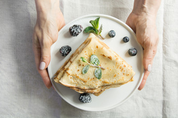 Traditional russian pancakes with blueberry. Springtime. Regional food. Homemade.