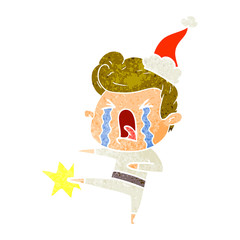 retro cartoon of a crying man wearing santa hat