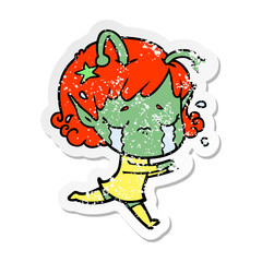 distressed sticker of a cartoon crying alien girl