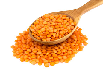 Lentil  in wooden spoon isolated on white background
