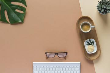 workspace  pen  glasses coffee cub pencil  notes  paperclip leaf monstera top view with copy space for your text. flat lay. 