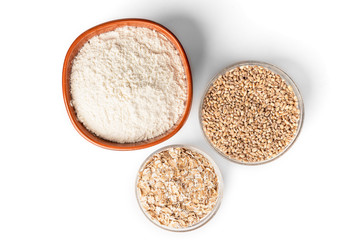 Wheat, flakes and  flour isolated on white background.