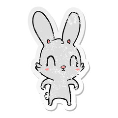 distressed sticker of a cute cartoon rabbit