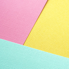 Fototapeta premium square-sized banner for publishing in a social network. multicolored textured paper. copy space..
