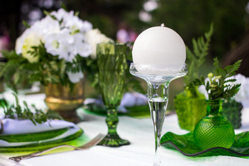 beautiful wedding table in green and white colors in nature