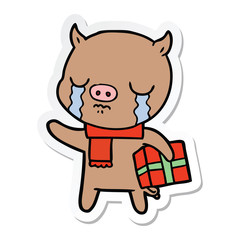 sticker of a cartoon pig crying over christmas present