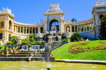 Marseille. Palais de Longchamp with fountains and sculptures in sunny day, view from the right side.