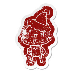 cartoon distressed sticker of a robot wearing santa hat