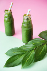 Fresh green smoothie with spinach leaves. A bottle of spring drink. Detox.