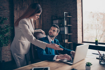 Close up photo look screen she her business lady he him his guy boss tell employer manager coacher check materials plans admit better chart graphs graphics sit office chair wearing formalwear suit