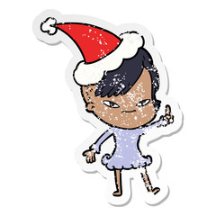 cute distressed sticker cartoon of a girl with hipster haircut wearing santa hat