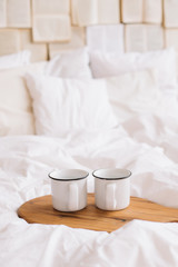 Fototapeta na wymiar White cups. Breakfast in bed. White bedroom. Sweet home. coffee cup. flat lay 
