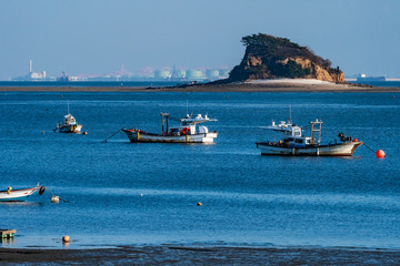 Seaside scenery in Incheon Metropolitan City, northwest port city of South Korea; boats are waiting for the high tide.