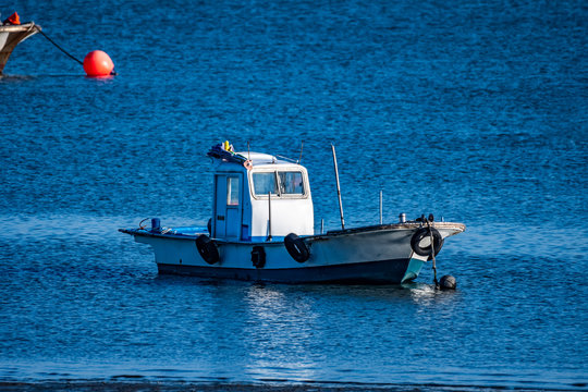 Seaside scenery in Incheon Metropolitan City, northwest port city of South Korea; boats are waiting for the high tide.