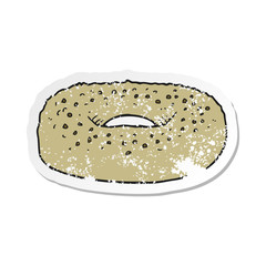 retro distressed sticker of a cartoon bagel