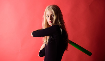 Baseball female player concept. Gentle but aptly. Kick off. Focused on result. Woman enjoy play baseball game. Girl tender blonde hold baseball bat on red background. Woman in baseball sport