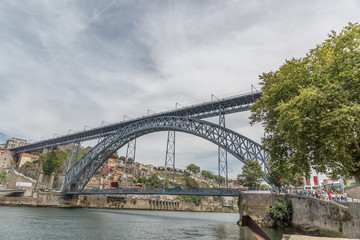 Fototapeta na wymiar The Dom Luis I Bridge is a metal arch bridge that spans the Douro River between the cities of Porto and Vila Nova de Gaia