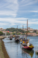 Fototapeta na wymiar Typical portuguese wooden boats, called -barcos rabelos- used in the past to transport the famous port wine towards the cellars of the city