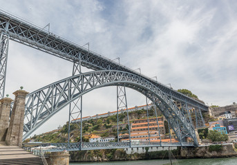 The Dom Luis I Bridge is a metal arch bridge that spans the Douro River between the cities of Porto and Vila Nova de Gaia