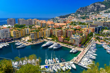 Fototapeta na wymiar Yachts in bay near houses and hotels, Fontvielle, Monte-Carlo, Monaco, Cote d'Azur, French Riviera