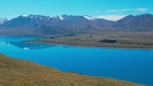 Lake Tekapo with reflection of sky and mountains, New Zealand