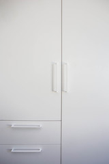 White closet doors wood closeup, modern design