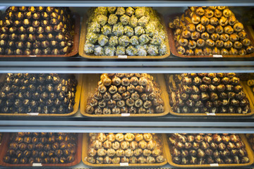 Piles of dates and other dried fruits in a traditional oriental market