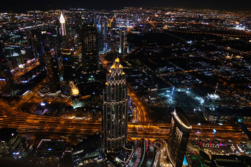 Obraz premium Aerial view of Dubai by night, famous place to visit in the Middle East