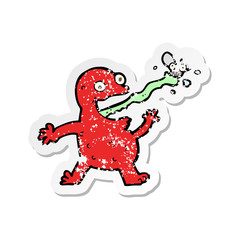 retro distressed sticker of a cartoon frog catching fly