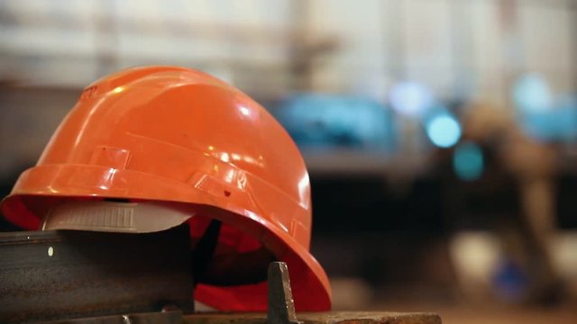 Construction plant. A helmet on a foreground