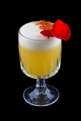 Refreshing cocktail in a glass on a black background.