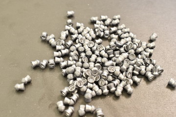 Metal objects: ball, nut and lead bullets.