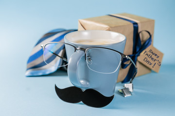 Fathers day concept - present, coffee, tie, mustache copy space