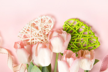 Flowers composition. Pattern made of tulip flowers on pink background.