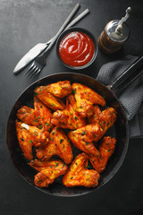 Chicken wings grilled in sauce on pan