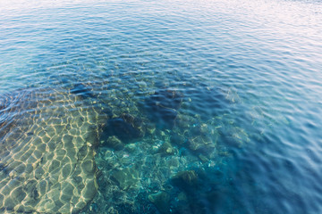 Fototapeta na wymiar clear transparent sea water on sunny day, barcelona, spain