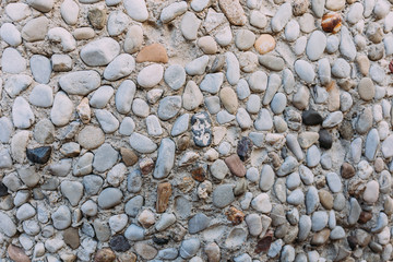 multicolored handwork textured stone wall, barcelona, spain